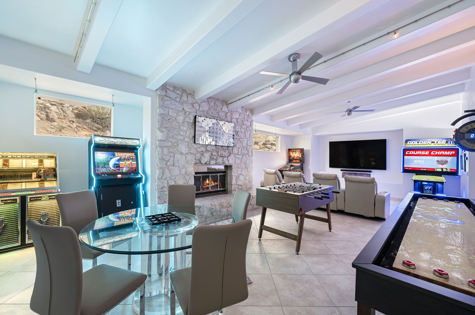 Game room with vintage pinball machines and a classic jukebox